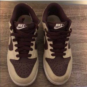 Gently worn tan and plum Nike sneakers
